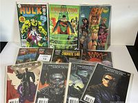Eleven comics including The Incredible Hulk, Kingdom Come, Gen 13, Maxx, and four Terminator issues, displayed upright and fanned out.