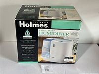 Front box view showing product image and features such as 2.5 gallon tank, suitable for small to medium rooms, Filter Check monitor, and removable tank.