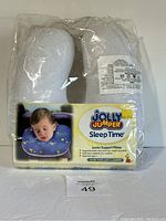 Photo of Jolly Jumper Sleep Time Junior Support Pillow in packaging, showing product details and image of a baby using the pillow.