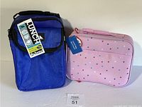 Blue and pink lunch bags side by side for overview of the lot