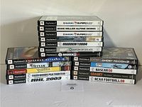 Photo of the stacked cases showing titles and labels of 17 PlayStation 2 games