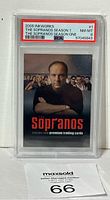 Front view of the 2005 Inkworks The Sopranos Tony Soprano #1 trading card in PSA graded slab showing grade NM-MT 8 with cast image background and bold red Sopranos title text.