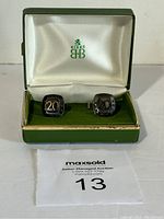 Pair of cufflinks in original BIRKS box with satin white and green lining, showing the '20' and Stelco marking