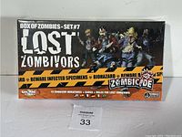 Photo of the box for Zombicide Box of Zombies Set #7 Lost Zombivors showing front of sealed packaging with artwork and text.