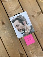 Front view of the AfterShokz Trekz Air product box showing a man wearing the headphones.