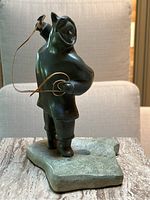 Front view of entire soapstone sculpture on base