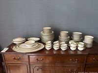 Full view of all stacks and dishes arranged on a wood surface