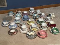 Overall view of all teacup and saucer sets arranged on floor