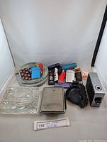 Photo showing the full set including ashtrays, lighters, cigarette cases and table lighter.