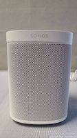 Front view showing Sonos logo and metal grille