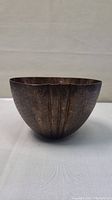 Front and side view of Zanetto copper bowl showing textured vertical lines and darkened patina