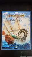 Front cover of the 1990 Advanced Dungeons & Dragons Dragonlance Otherlands soft cover book showing a fantasy ship and sea serpent illustration