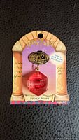 Front of sealed Harry Potter Story Scope toy on card with red jewel