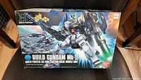 Box front showing artwork and branding of the HG Build Fighters Gundam MK-II model kit