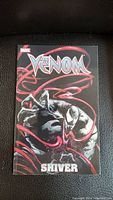 Front cover image of Marvel Venom graphic novel titled 'Shiver' showing artwork of Venom with red tendrils.