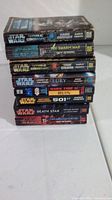 Stack of 8 Star Wars paperback books with titles visible on the spines including Republic Commando, Dark Tide, Fury, Hutt, Death Star.