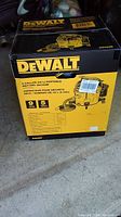 Full box of DeWalt DXV09P 9 gallon portable wet/dry vacuum, front view showing brand and model details.