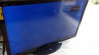 Photo of Sharp 60" Aquos TV showing the screen with 'No Signal' message, black bezel and oval base stand.