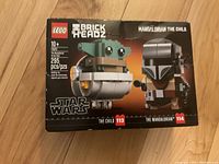 Front view of unopened LEGO BrickHeadz box featuring The Mandalorian and The Child from Star Wars.