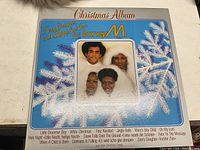 Front cover of Boney M Christmas Album vinyl record showing band photo and decorative frost design
