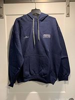 Front view of navy blue men's hoodie with front pocket hanging on hanger. Shows embroidered logos 'Matter' and 'KeepRite' on chest and gray drawstrings on hood.