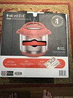 Box of Instant Pot Duo 6 Quart showing front of packaging with branding and product details.