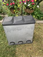 Front view of the recycle bin showing three lids and foot pedals.