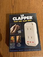 Front box view showing 'Le Clapper' branding, device image, and 'Clap On! Clap Off!' slogan.