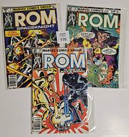 Three ROM comic books from Marvel Comics Group displayed together, showing different cover artwork and titles in protective sleeves.