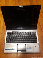 Open view of HP Pavilion laptop showing keyboard and screen area.