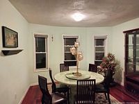 Wide view showing all six rosewood dining chairs around a table