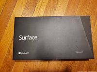 Microsoft Surface RT tablet box front showing Surface logo and Windows RT branding.