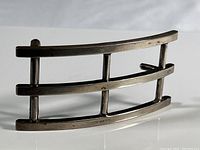 Front view of the sterling silver belt buckle showing three horizontal bars connected by three vertical bars with a curved rectangular frame.