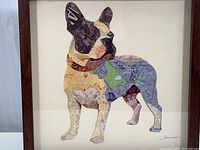 Full view of framed paper collage showing French Bulldog composed of map pieces in a shadow box frame.