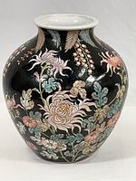 Front side view of Chinese black matte vase with colorful floral hand-painted designs