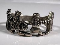 Close-up front view of the sterling silver Alice in Wonderland ring showcasing White Rabbit with pocket watch and other character details