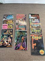 Photo showing full set of 13 comic books arranged in three columns with visible front covers.