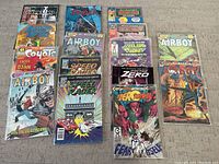 Full lot of 15 comic books arranged in groups on a carpeted floor for visual cataloguing.