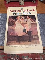 Front cover of the oversized book titled 'The Norman Rockwell Poster Book' showing a classic Rockwell painting of people at a barbershop counter.