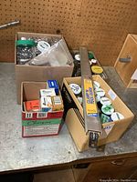 Box with assorted screws and metal clips and other hardware items