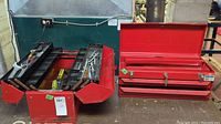 Closed red metal chest style tool box next to open red cantilever tool box showing trays with wrenches and screwdrivers.