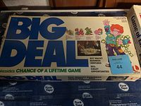Box of Big Deal board game showing colorful cartoon characters and game details.