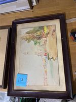 Full view of the framed watercolor painting showing the overall scene in a dark wood frame with gold trim.