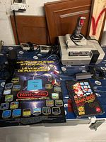 NES console, controllers, Zapper, cables, cartridge and box laid out