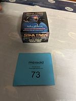 Box of Star Trek Deep Space Nine Series Premiere Trading Cards from SkyBox on a table with a lot card number 73
