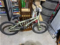 Side view of the full bicycle showing frame, wheels, seat, and handlebars.