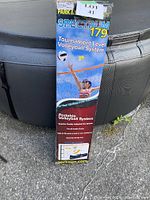 Boxed Spectrum 179 Tournament Level Volleyball System showing front panel with volleyball player and product details