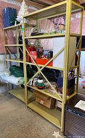 Metal shelving units against basement wall with storage items on shelves to show size and condition.
