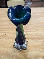 Image showing the angled side view of the blue and green art glass vase resembling Jack in the Pulpit flower with clear base.
