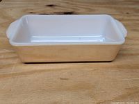 Side angle showing peach luster exterior and interior white finish.